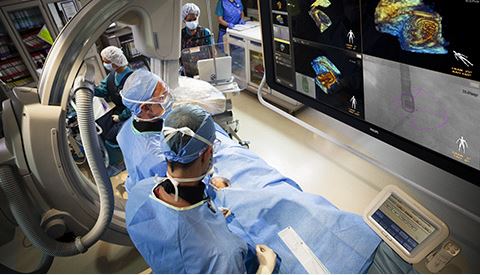 Clinicians monitoring a patient's data in the operating room