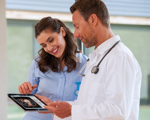 Clinicians with an iPad tablet