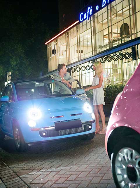 blue car with man and woman