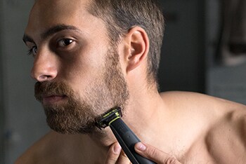 Man shaving beard