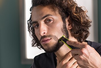 Man shaving beard